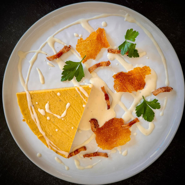 Butternut Squash Flan with Goat’s Milk Taleggio, Guanciale, and Crispy Polenta