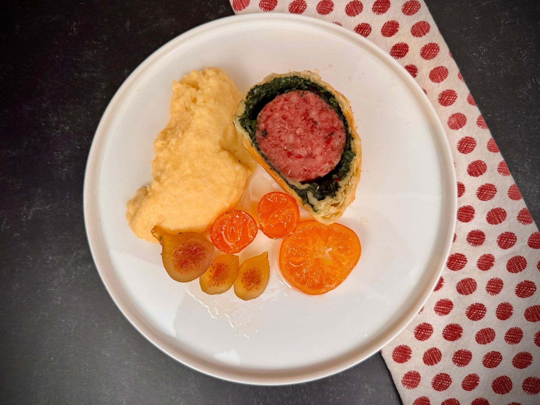 Cotechino en croute with Parmigiano polenta and mixed fruit mostarda