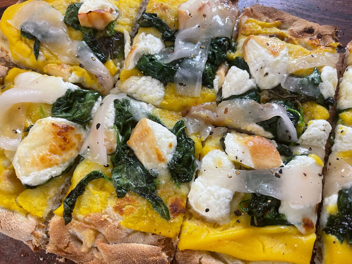 Pinsa Romana with Buttenut squash, smoked burrata, lardo and spinach ...