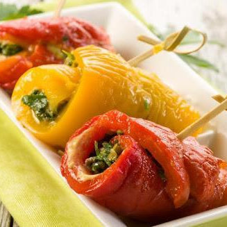 Rolls of marinated pepper and strawberry