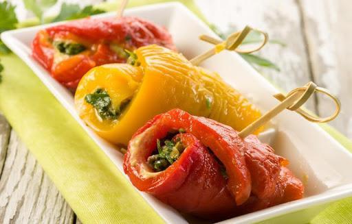 Rolls of marinated pepper and strawberry