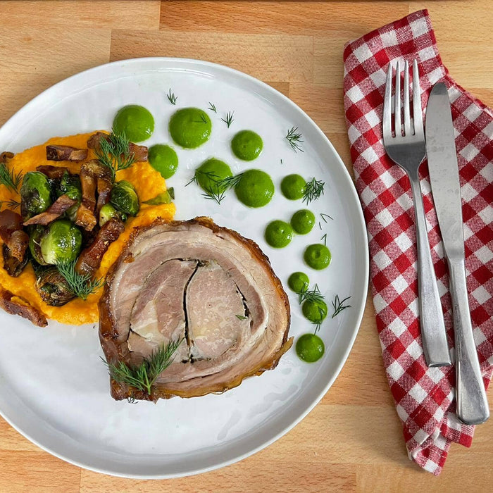 Roman Style Porchetta with guanciale, brussels sprouts, mashed sweet potatoes and salsa verde